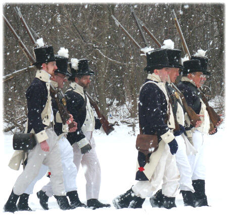 Troops marching in the snow as might have during the Battle of the River Raisin.